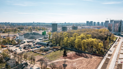 Fototapeta premium Aerial panoramic view of the construction of residential houses in the microdistricts. Space for text. Cityscape concept.