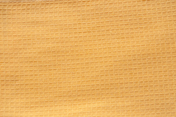 Yellow linen background close up with square weave