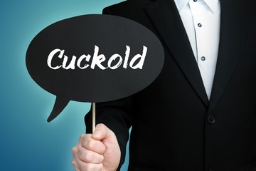 Cuckold. Lawyer in suit holds speech bubble at camera. The term Cuckold is in the sign. Symbol for law, justice, judgement - obrazy, fototapety, plakaty