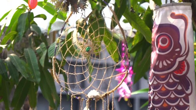 Dream catcher haging froma tree in a temple of Thailand.