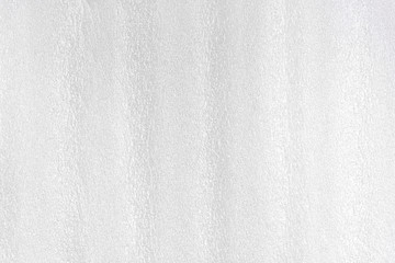 Foam white plastic texture. Styrofoam abstract grey surface with grain structure.