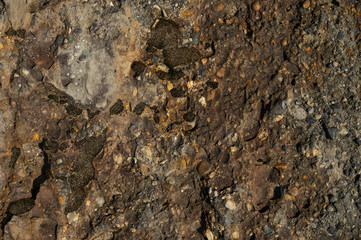 Stone texture with hard light, for design. Orange rock.Textured stone texture with hard light, for design. Orange rock.