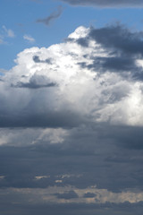 Obraz premium Sky with white and dark blue clouds. Dramatic cloudy sky background.Moody Cloudscape