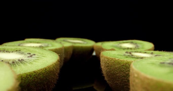 Freshly picked  green kiwi fruit cut in half super macro close up shoot fly over laowa k4 high quallity