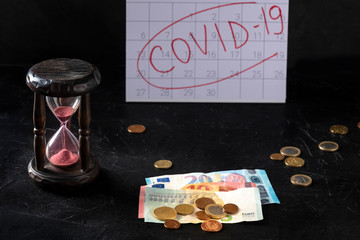 Covid 19 impact on European economy, severe economical consequences of the quarantine concept. Hourglass, monthly calendar and the last savings in euros