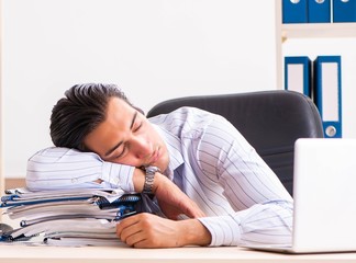 Young employee sitting at the office