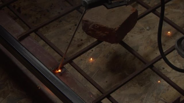 Welder uses torch to make sparks
