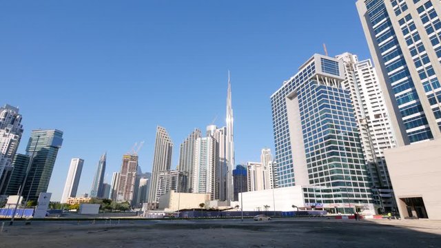 Spectacular city skyline, skyscrapers and Burj Khalifa in downtown Dubai, pan
