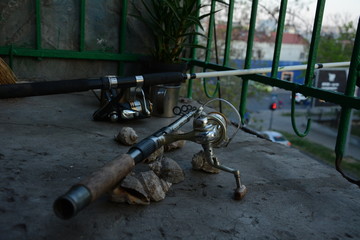  fishing rod and shells on the balcony