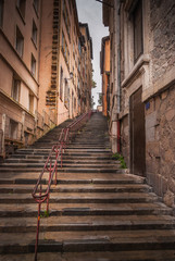 Fototapeta na wymiar Montee des Carmes Dechausses steps in Fourviere, a Typical narrow street of the Vieux Lyon (old Lyon), on Colline de Fourviere Hill