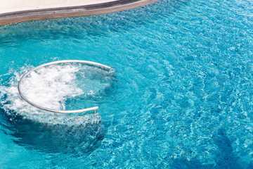 Fototapeta na wymiar swimming pool with rail and splash water .
