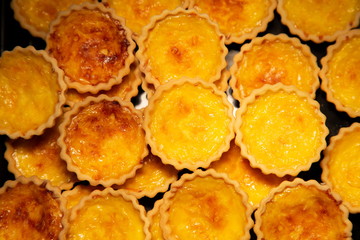 tart egg custard baked crispy sweet dessert .