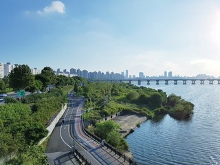 Naklejka na ściany i meble Panoramic View Of Bridge Over River In City Against Sky