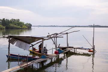 Fototapeta na wymiar fisherman boat on river at countryside wooden port .