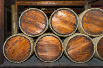 Obraz premium A cellar with wooden vintage barrels. Front view