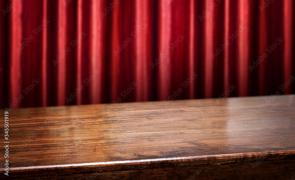 Poster wood diagonal table with red red curtain wall blur background.Mock up  banner for display of product