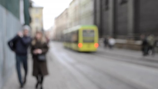 Abstract Defocused Blurred Background of many people on street square