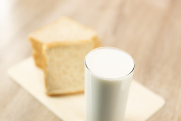 Fototapeta na wymiar Close up fresh healthy milk and bread on pink background