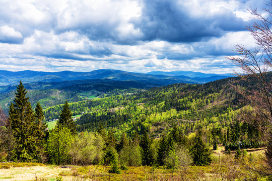 View of Beskid Slaski mountain range from the nearby slopes in Wisla and Ustron - popular tourist destination towns. Beskid Slaski is part of Carpathian mountains