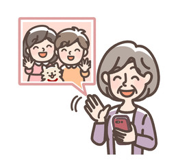 孫とビデオ通話するおばあさん