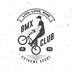 Bmx extreme sport club badge. Vector. Concept for shirt, logo, print, stamp, tee with man ride on a sport bicycle. Vintage typography design with bmx cyclist silhouette.