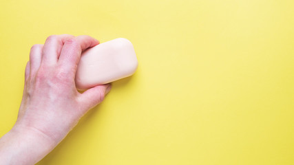 Natural soap on a yellow background. Flat lay the concept of Spa cleanliness of hands. copy space