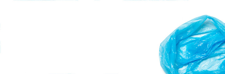 Fototapeta premium Open blue trash bag on an isolated white background. The concept of cleaning, garbage removal. Flat lay, top view