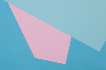 Blue and pink background, colored paper geometrically divides into zones, frame, copy, space.