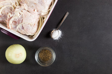Chicken thighs with onions and mayonnaise, a simple recipe for homemade attraction, preparation for baking.
