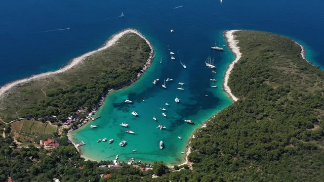 Beautiful Beach Palmizana on Paklinski Islands near City of Hvar in Croatia, Aerial Panoramic View with Yachts and Sailboats on the Tirkiz Blue Sea