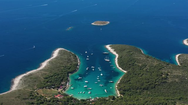 Beautiful Beach Palmizana on Paklinski Islands near City of Hvar in Croatia, Aerial Panoramic View with Yachts and Sailboats on the Tirkiz Blue Sea