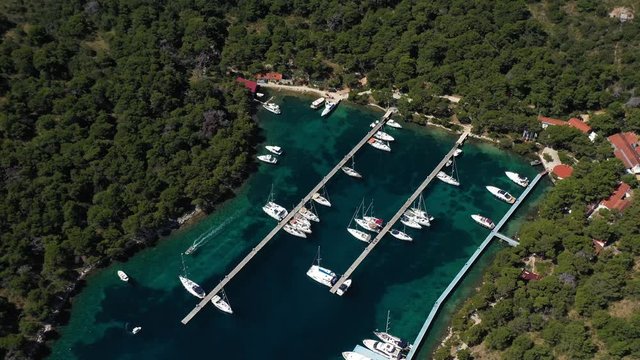 Sailboats and Yachts on Berth in Marina Palmizana on Paklinski Islands near City of Hvar - Aerial Panoramic View