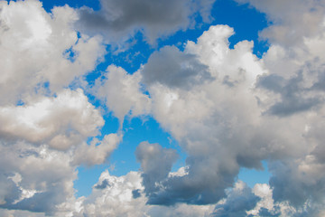 large rain white clouds in the blue sky