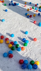 Colored plastic balls in the snow