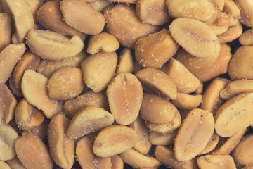 Top view of peeled peanuts as background , texture
