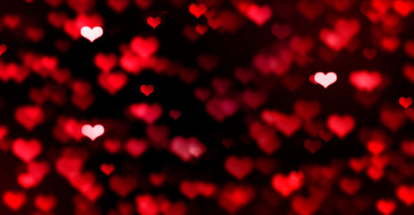 Red bokeh hearts on black background, blurred, love, bright, Valentine's day, romance