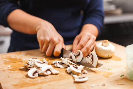 Woman Cutting Fresh Organic Mushrooms On Chopping Board, Making Healthy Low Calories Salad.