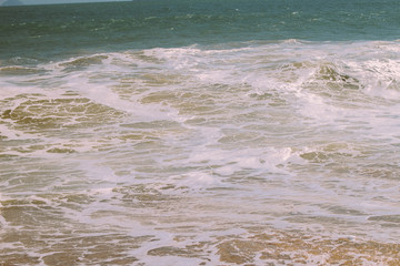 Beautiful waves on the shore of the central beach of Nha Trang, Vietnam.
