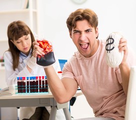 Man giving his blood as a donor