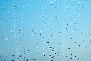 Naklejka na ściany i meble Raindrops or steam shower, on a transparent glass background. Realistic clean drops flow down.