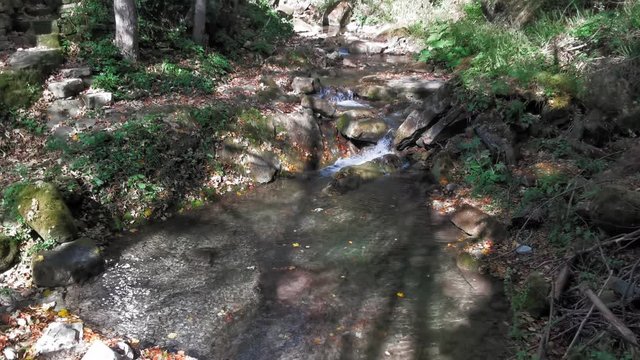 The natural small pool of pure radium water is self created on the side of the Carpathian mountains. Tourism in the mountains of the Carpathians, Ukraine. Prores 422