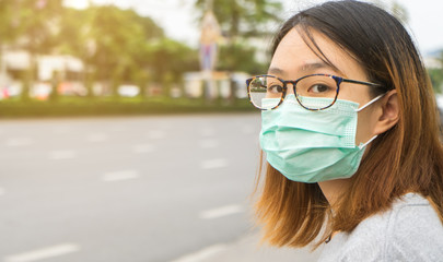 A woman wearing protective face mask and cough, get ready for prevent Coronavirus and pm 2.5 . Hygiene concept