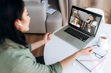 Online teaching. Young girl teacher conducts a lesson by video conference to her students