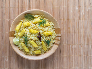 Biryani with baby corn. Spicy baby corn rice. Indian food