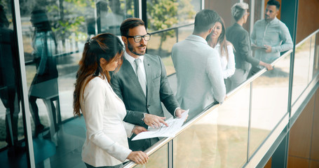 Business colleagues having conversation during coffee break