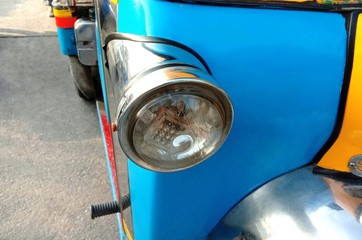 Right turning light of motor tricycle transport on the Thailand road.