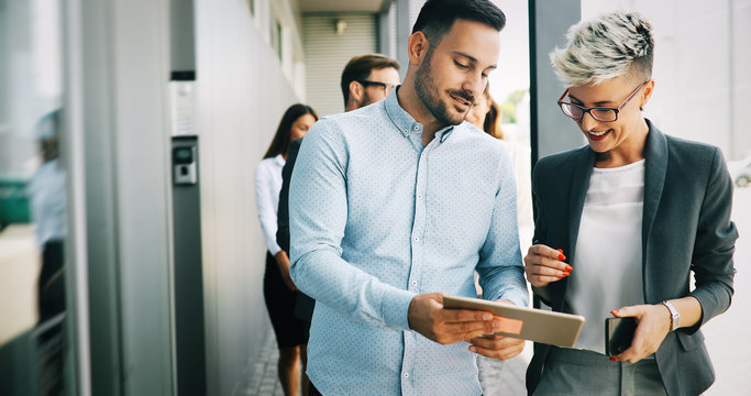 Business Colleagues Having Conversation During Coffee Break