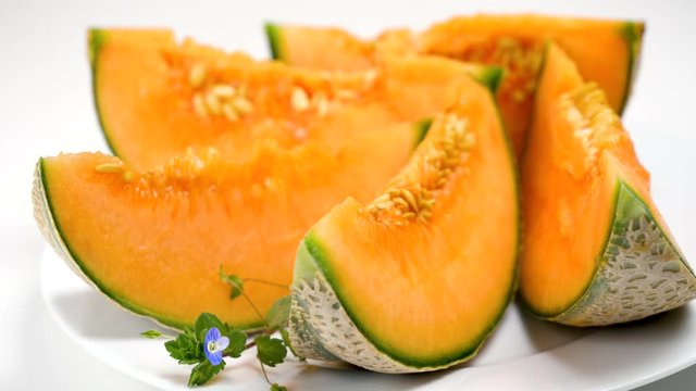 melon slices in plate white background
