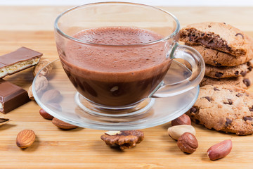 Hot chocolate among the chocolate chip cookies, chocolate pieces, nuts