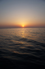 beautiful sunrise and ship on sea 